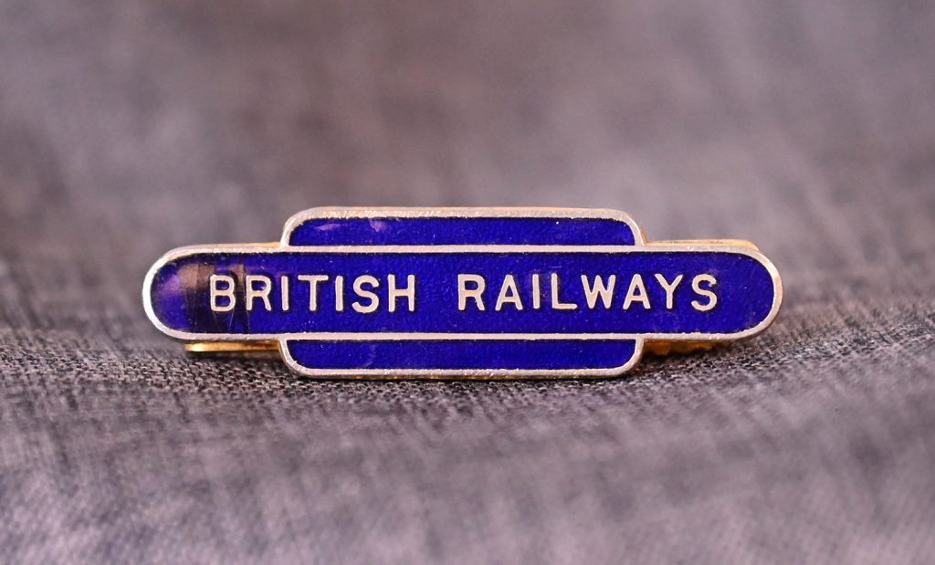 ABOVE: A gold tone metal with blue enamel British Railways tie clip.