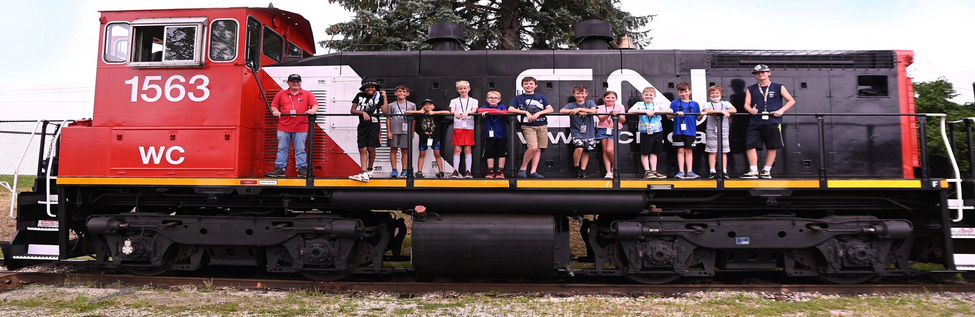 Campers on side of diesel locomotive