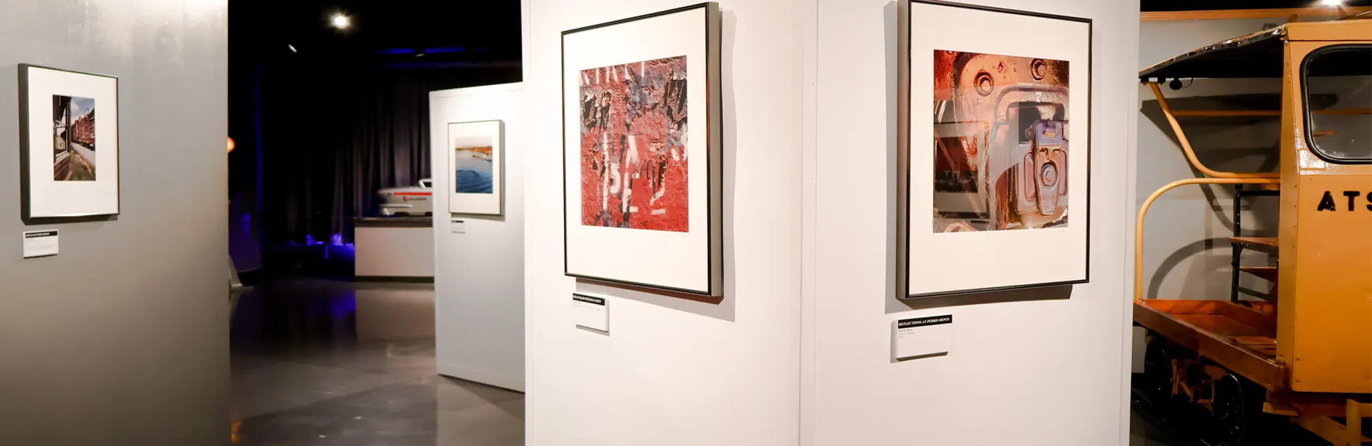 Framed photography on display in the National Railroad Museum's 2026 exhibit, Seldom Seen Scenes of Railroading.